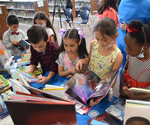 Preface donates More than 200 new books to Graves Elementary School library